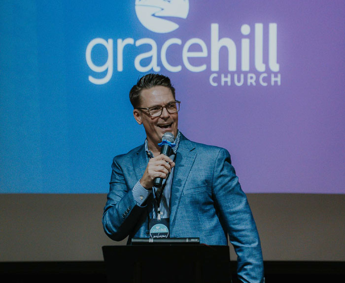 Pastor Moran Smiles and speaks
